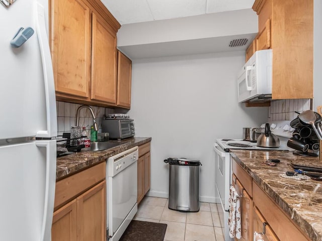 10813 Seaview Ave Unit 41B, Brooklyn, NY 11236 - kitchen featuring white appliances, light tile patterned floors, a sink, and dark stone counters