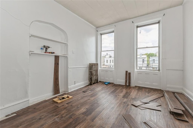 171 Hale Ave, Brooklyn, NY 11208 - unfurnished living room with wood finished floors and baseboards