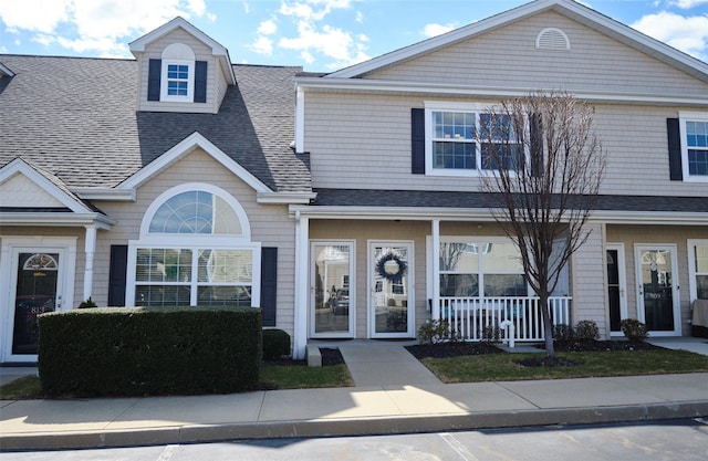 812 Willow Ln, Valley Stream, NY 11580 - townhome / multi-family property with roof with shingles and a porch