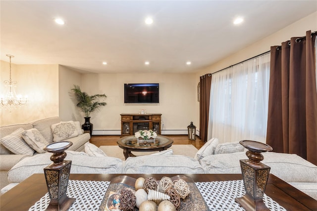 91-10 164th, Howard Beach, NY 11414 - living area featuring a baseboard heating unit, a chandelier, recessed lighting, wood finished floors, and baseboard heating