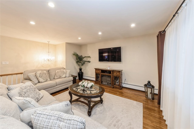 91-10 164th, Howard Beach, NY 11414 - living room with baseboard heating, recessed lighting, wood finished floors, and a chandelier
