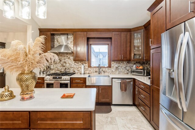 91-10 164th, Howard Beach, NY 11414 - kitchen featuring appliances with stainless steel finishes, wall chimney exhaust hood, a sink, and light countertops