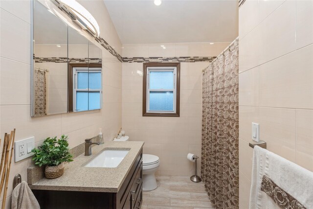 91-10 164th, Howard Beach, NY 11414 - full bathroom with tile walls, toilet, vanity, and curtained shower