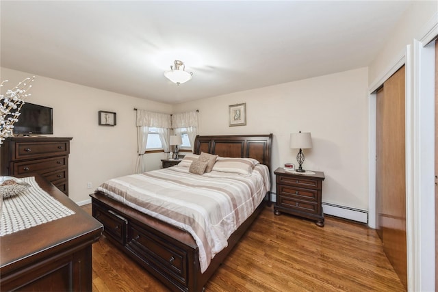 91-10 164th, Howard Beach, NY 11414 - bedroom with a baseboard heating unit and wood finished floors