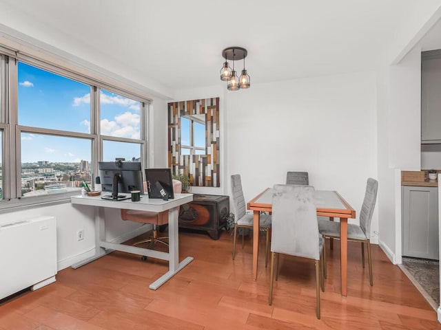 555 Kappock St Unit 18C, Bronx, NY 10463 - dining space featuring a chandelier, healthy amount of natural light, light wood-type flooring, and a desk