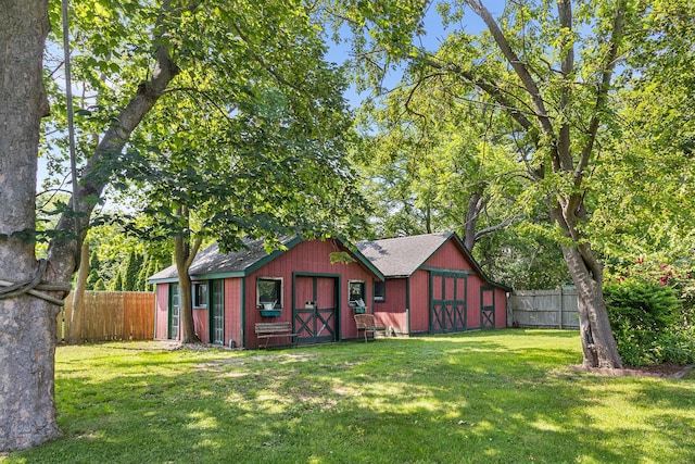 30 Railroad Ave, Center Moriches, NY 11934 - rear view of property featuring a fenced backyard and an outbuilding