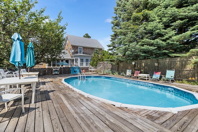 30 Railroad Ave, Center Moriches, NY 11934 - view of swimming pool with a wooden deck and a fenced backyard