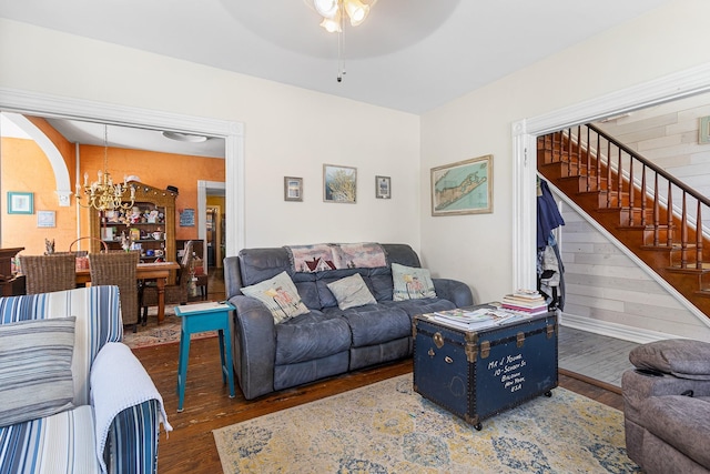 30 Railroad Ave, Center Moriches, NY 11934 - living area featuring wood finished floors, a chandelier, stairway, and a ceiling fan