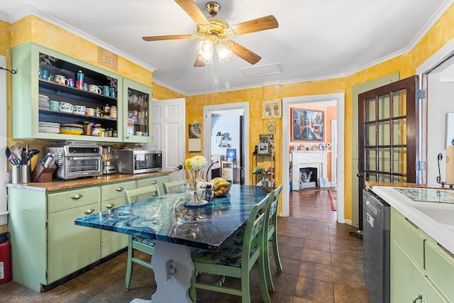 30 Railroad Ave, Center Moriches, NY 11934 - kitchen with green cabinets, appliances with stainless steel finishes, ceiling fan, a fireplace, and ornamental molding