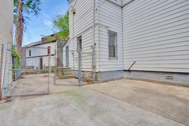 8 Van Siclen Ave, Brooklyn, NY 11207 - view of side of home with a gate, crawl space, and fence