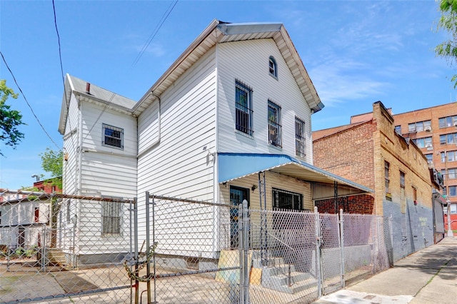 8 Van Siclen Ave, Brooklyn, NY 11207 - view of front of home featuring a gate and a fenced front yard