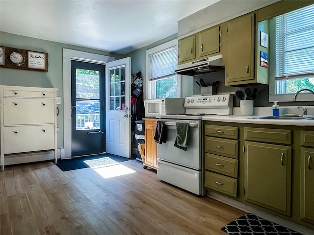 40 Cream St, Poughkeepsie, NY 12601 - kitchen with white appliances, under cabinet range hood, healthy amount of natural light, and a sink