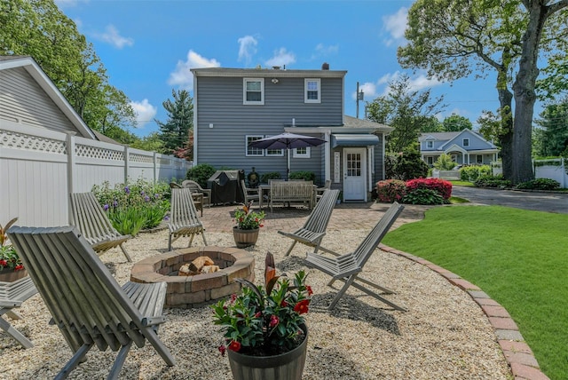 935 Harrison Dr, Centerport, NY 11721 - rear view of property with an outdoor fire pit and a patio area