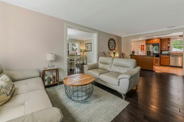 935 Harrison Dr, Centerport, NY 11721 - living area with hardwood / wood-style floors and crown molding
