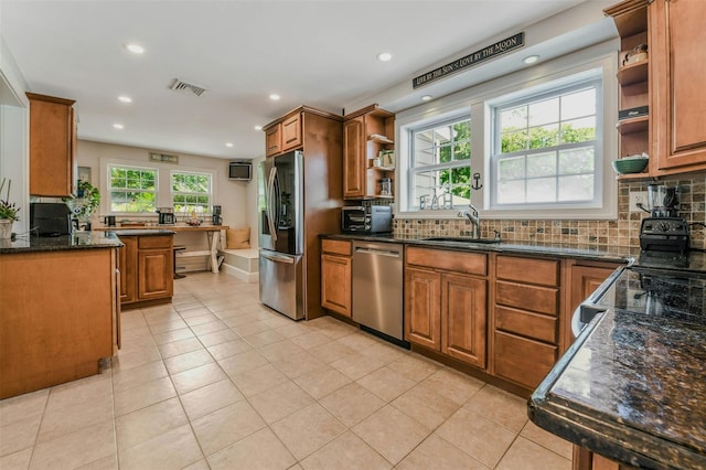 935 Harrison Dr, Centerport, NY 11721 - kitchen with stainless steel appliances, open shelves, a sink, brown cabinetry, and recessed lighting
