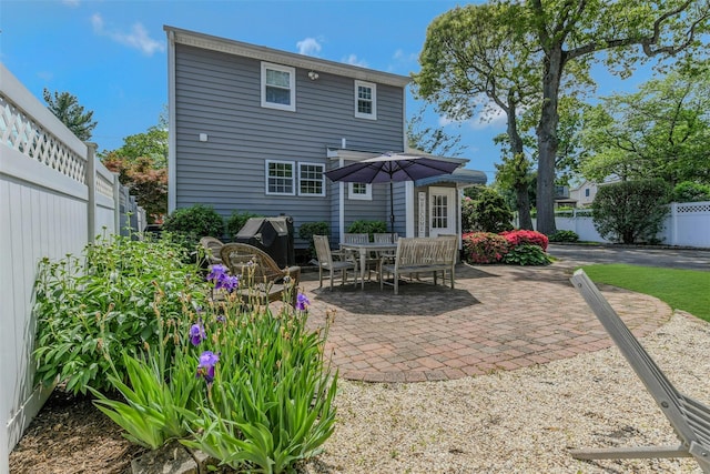 935 Harrison Dr, Centerport, NY 11721 - rear view of house featuring a patio