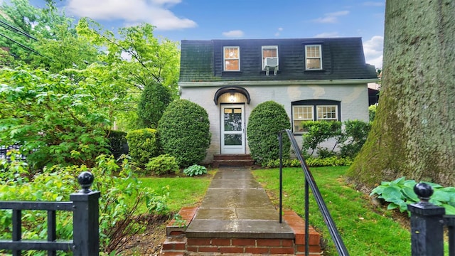 19 Barstow Rd Unit G, Great Neck, NY 11021 - view of front of property featuring brick siding, mansard roof, and a shingled roof