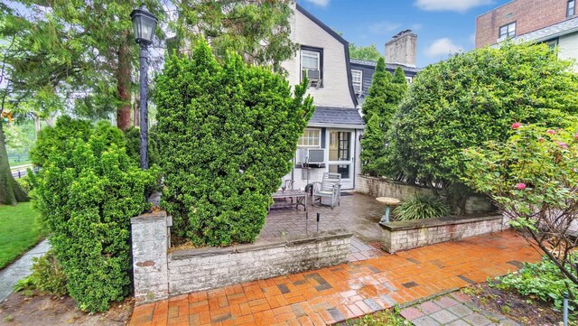 19 Barstow Rd Unit G, Great Neck, NY 11021 - rear view of property with a patio area and cooling unit