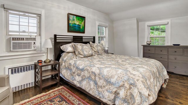 19 Barstow Rd Unit G, Great Neck, NY 11021 - bedroom with radiator, hardwood / wood-style floors, vaulted ceiling, and cooling unit