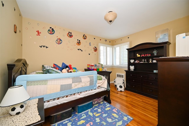 bedroom featuring wood finished floors