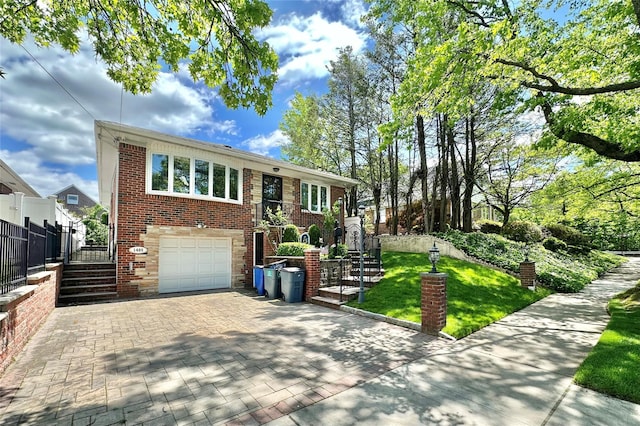14-85 166th St, Whitestone, NY 11357 - view of front of home with stairs, decorative driveway, a garage, and brick siding