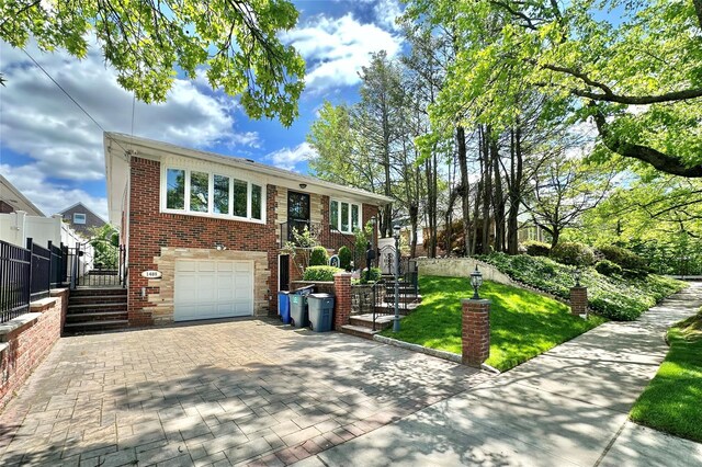 14-85 166th St, Whitestone, NY 11357 - view of front of house with stairway, decorative driveway, brick siding, and an attached garage