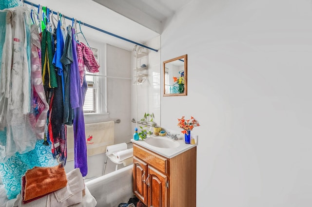 bathroom with vanity and a shower