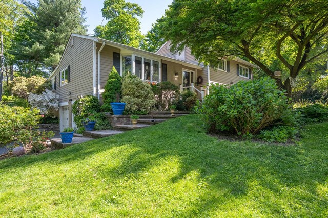 10 Falcon Pl, Huntington, NY 11743 - split level home featuring a front yard
