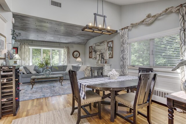 10 Falcon Pl, Huntington, NY 11743 - dining area featuring light wood-style flooring and vaulted ceiling