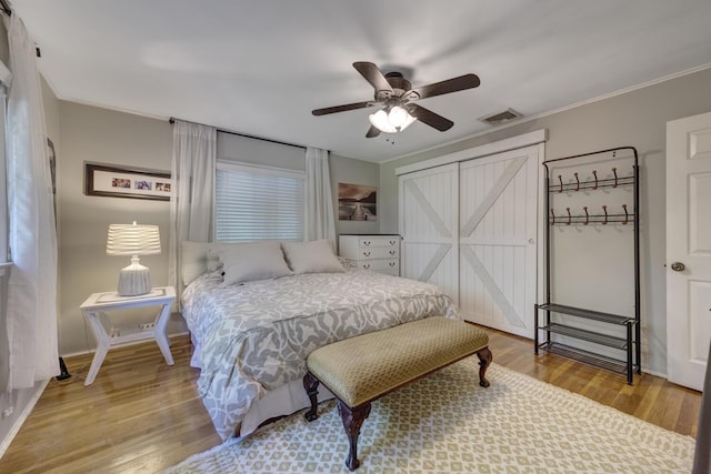 10 Falcon Pl, Huntington, NY 11743 - bedroom with wood finished floors, crown molding, a ceiling fan, baseboards, and a closet