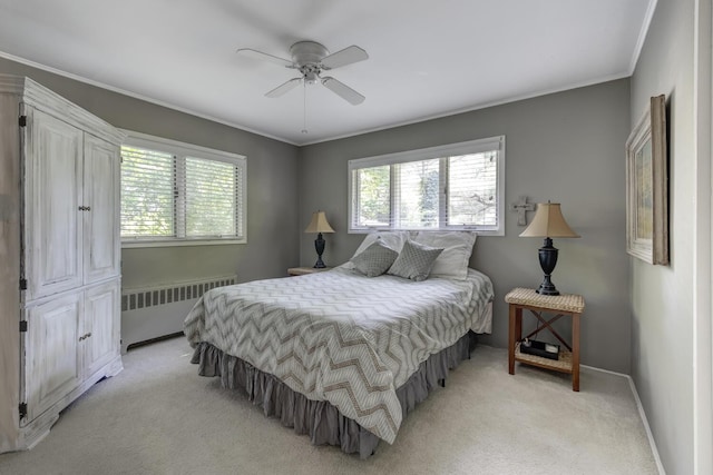 10 Falcon Pl, Huntington, NY 11743 - bedroom with radiator, multiple windows, light carpet, ornamental molding, and baseboards