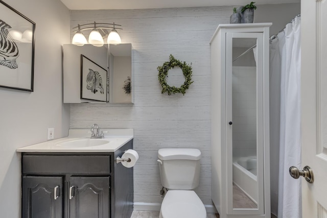 10 Falcon Pl, Huntington, NY 11743 - bathroom featuring vanity, toilet, shower / tub combo, and wood walls