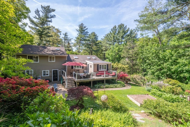 10 Falcon Pl, Huntington, NY 11743 - rear view of house with a deck, a yard, and a chimney