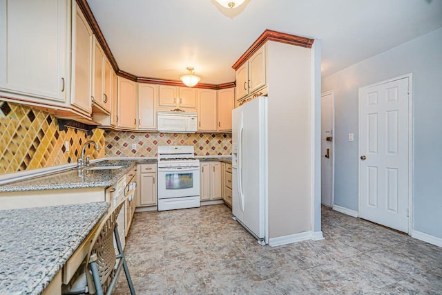 2265 Gerritsen Ave Unit 5C, Brooklyn, NY 11229 - kitchen with white appliances, a sink, light stone countertops, backsplash, and baseboards