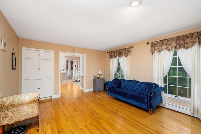 17 Stonegate Dr, Hyde Park, NY 12538 - living area featuring light wood-style floors, baseboards, and a baseboard radiator