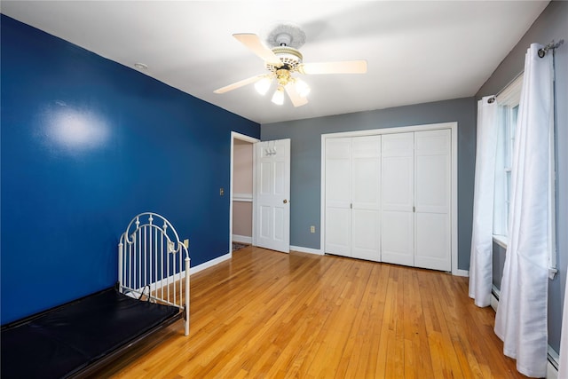17 Stonegate Dr, Hyde Park, NY 12538 - unfurnished bedroom featuring wood-type flooring, baseboards, a closet, and ceiling fan