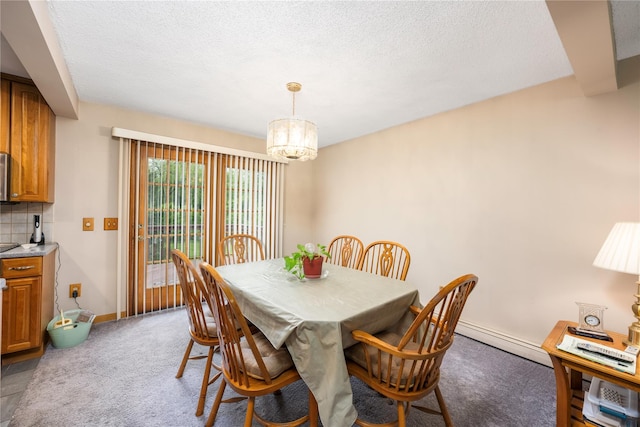 3 Sodano Rd, Hopewell Junction, NY 12533 - carpeted dining area featuring a baseboard radiator, a chandelier, a textured ceiling, and baseboards