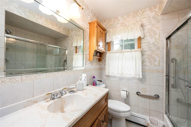 3 Sodano Rd, Hopewell Junction, NY 12533 - full bath with a baseboard radiator, wallpapered walls, vanity, tile walls, and toilet