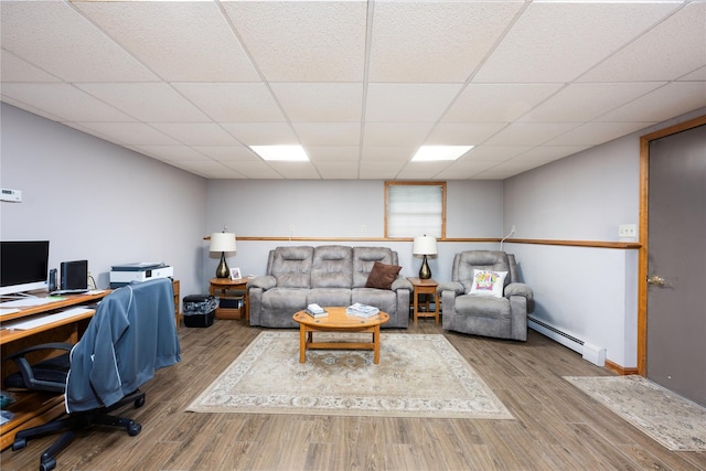 3 Sodano Rd, Hopewell Junction, NY 12533 - office space with a baseboard heating unit, wood finished floors, a drop ceiling, and baseboards