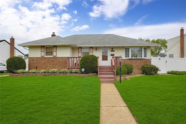 812 Colridge Rd, Wantagh, NY 11793 - view of front of home featuring brick siding, a gate, a chimney, and roof with shingles