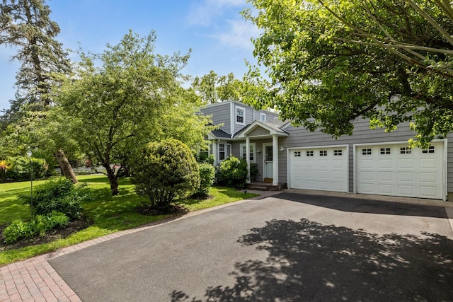 85 Shore Rd, Amityville, NY 11701 - view of front facade featuring asphalt driveway and a front yard