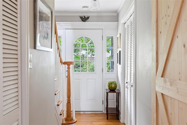 85 Shore Rd, Amityville, NY 11701 - foyer entrance with stairs, ornamental molding, and light wood-type flooring