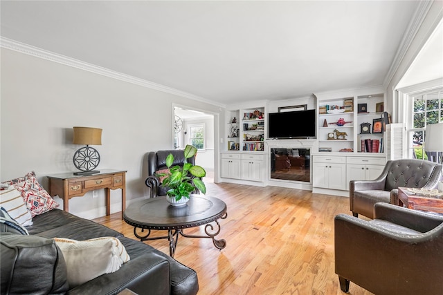 85 Shore Rd, Amityville, NY 11701 - living room featuring light wood-style flooring, plenty of natural light, and ornamental molding