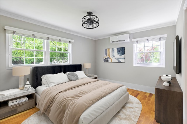 85 Shore Rd, Amityville, NY 11701 - bedroom featuring a wall unit AC, multiple windows, ornamental molding, baseboards, and light wood-type flooring