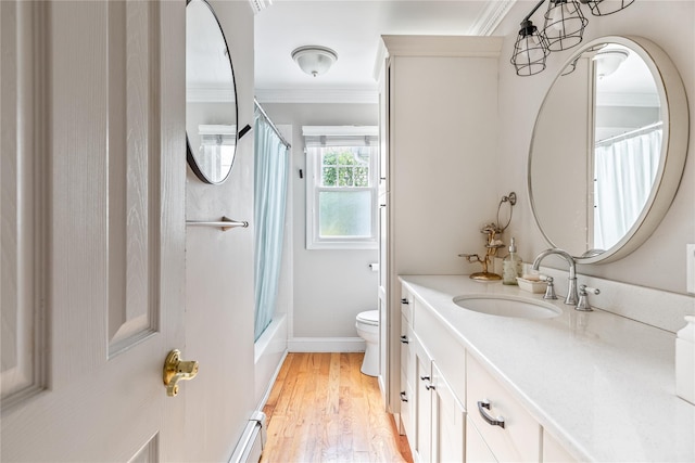 85 Shore Rd, Amityville, NY 11701 - bathroom with crown molding, vanity, toilet, wood finished floors, and shower / tub combo with curtain