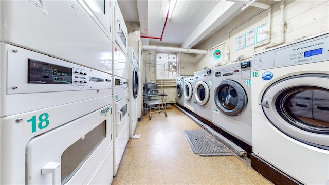 communal laundry room featuring estacked washer and dryer, light floors, and independent washer and dryer