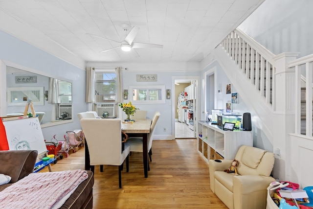 25-36 83rd St, East Elmhurst, NY 11370 - dining area with stairway, a ceiling fan, and wood finished floors