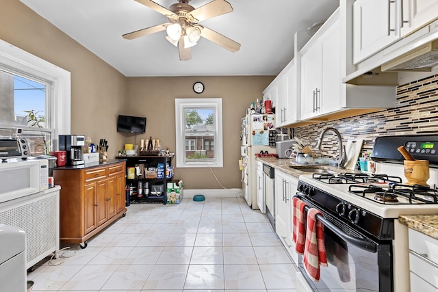 25-36 83rd St, East Elmhurst, NY 11370 - kitchen with white appliances, a sink, tasteful backsplash, ceiling fan, and white cabinetry