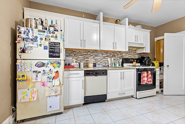 25-36 83rd St, East Elmhurst, NY 11370 - kitchen featuring white appliances, white cabinetry, a sink, and decorative backsplash