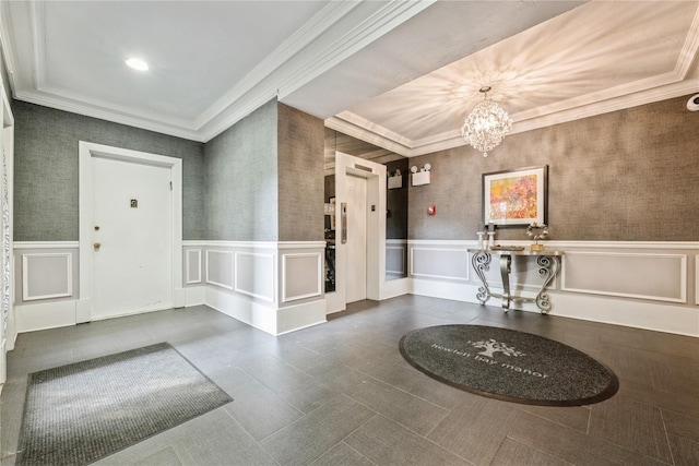 1175 E Broadway Unit 2J, Hewlett, NY 11557 - entryway with crown molding, a chandelier, and wainscoting